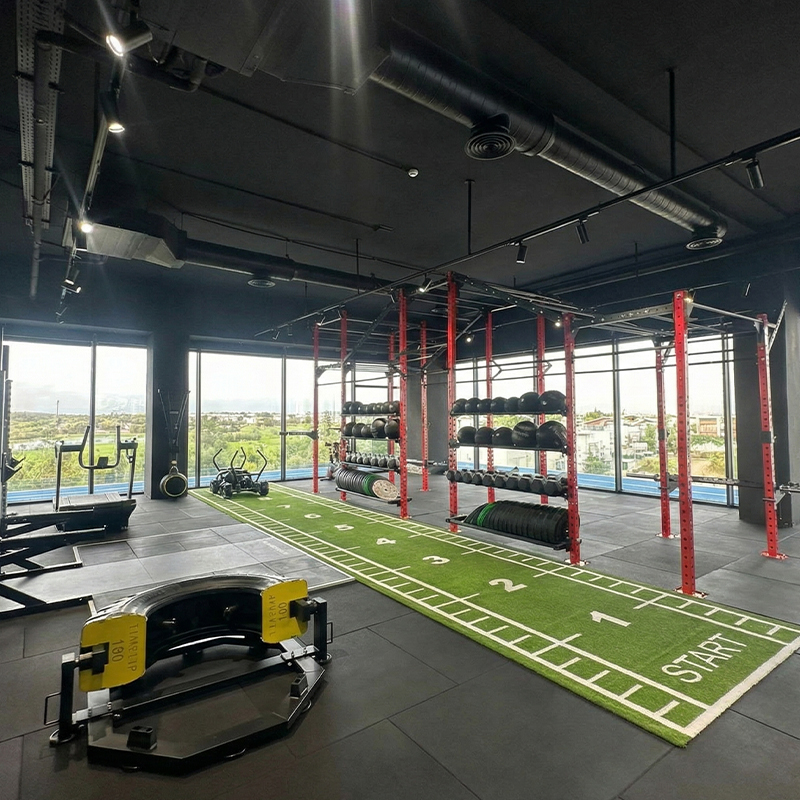 Premium cross-training studio at Eliteness featuring functional fitness zones, strength equipment, and an elevated training layout.